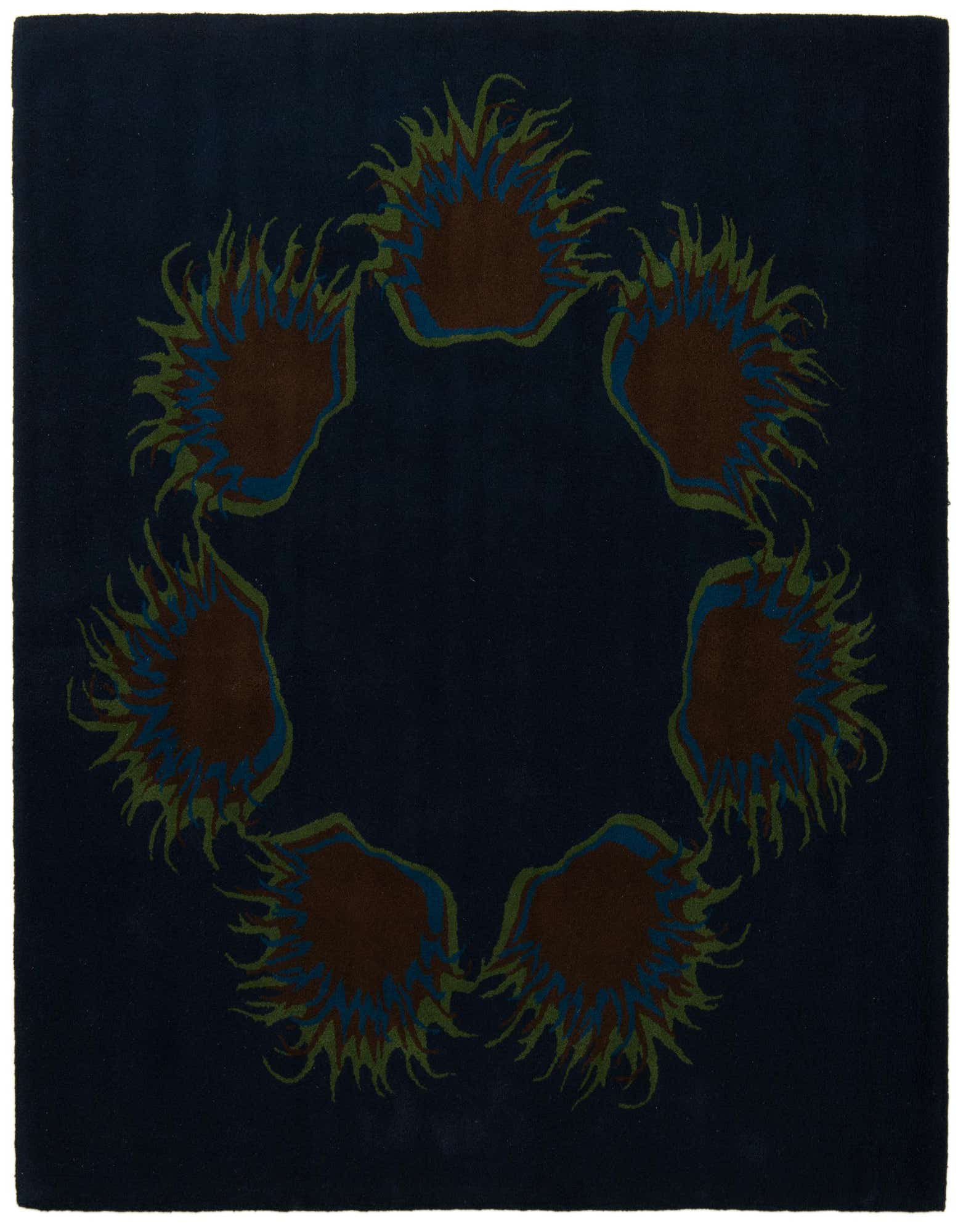 A square navy blue rug with a circular modern floral pattern featuring brown, green, and light blue accents.