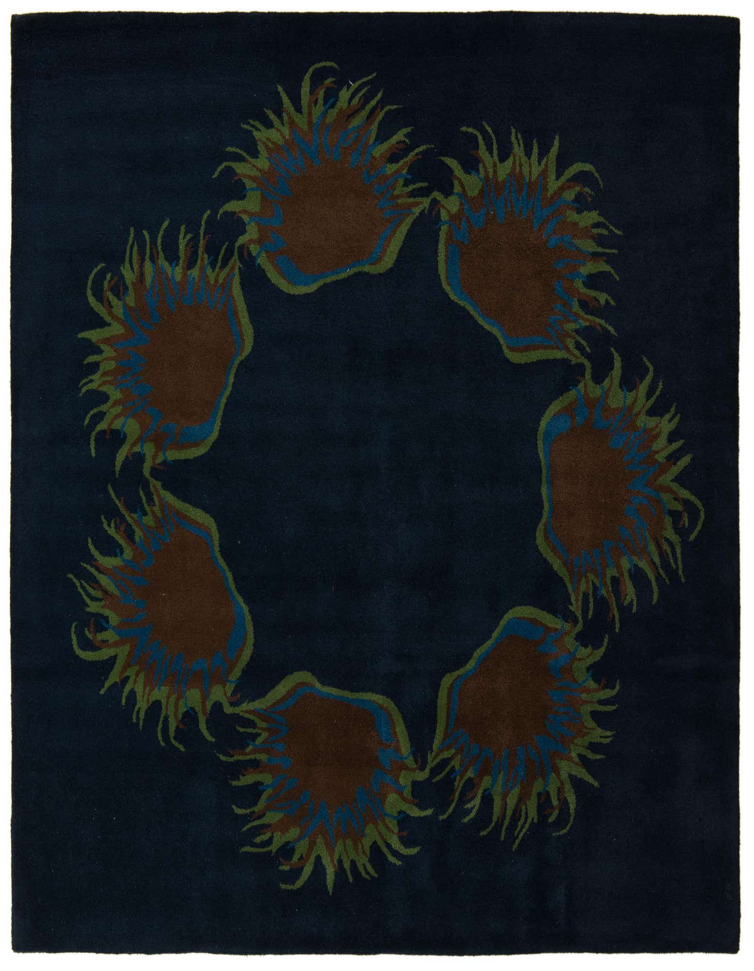 A square navy blue rug with a circular modern floral pattern featuring brown, green, and blue accents.