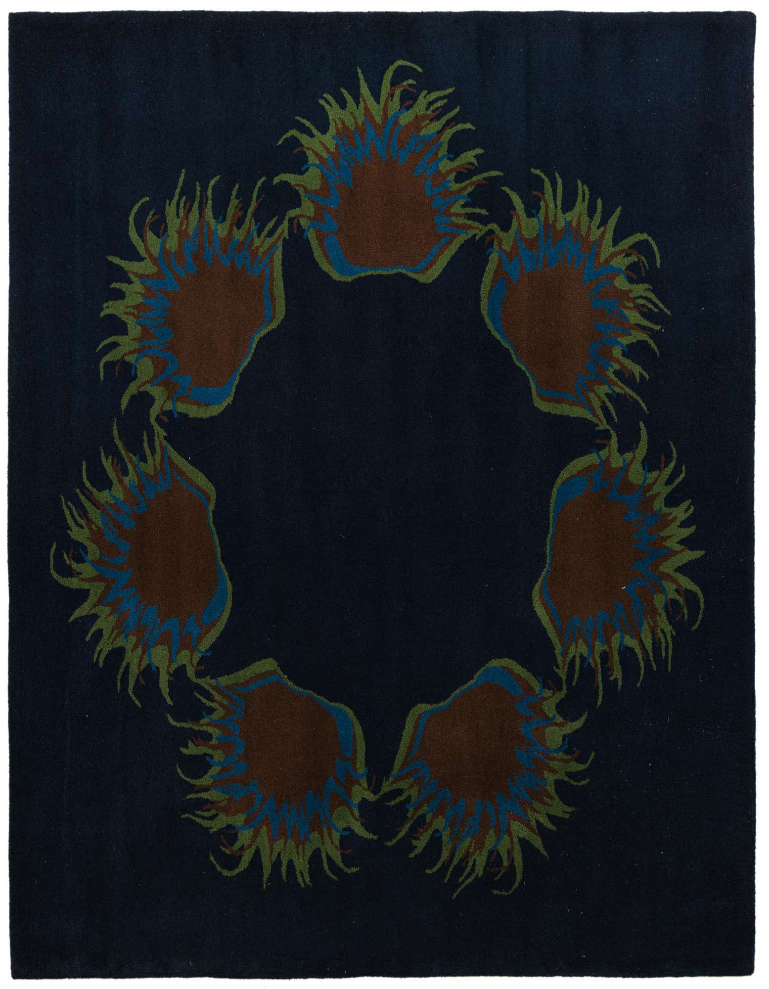 A square navy blue rug with a central circular floral design featuring brown, blue, and green botanical patterns.