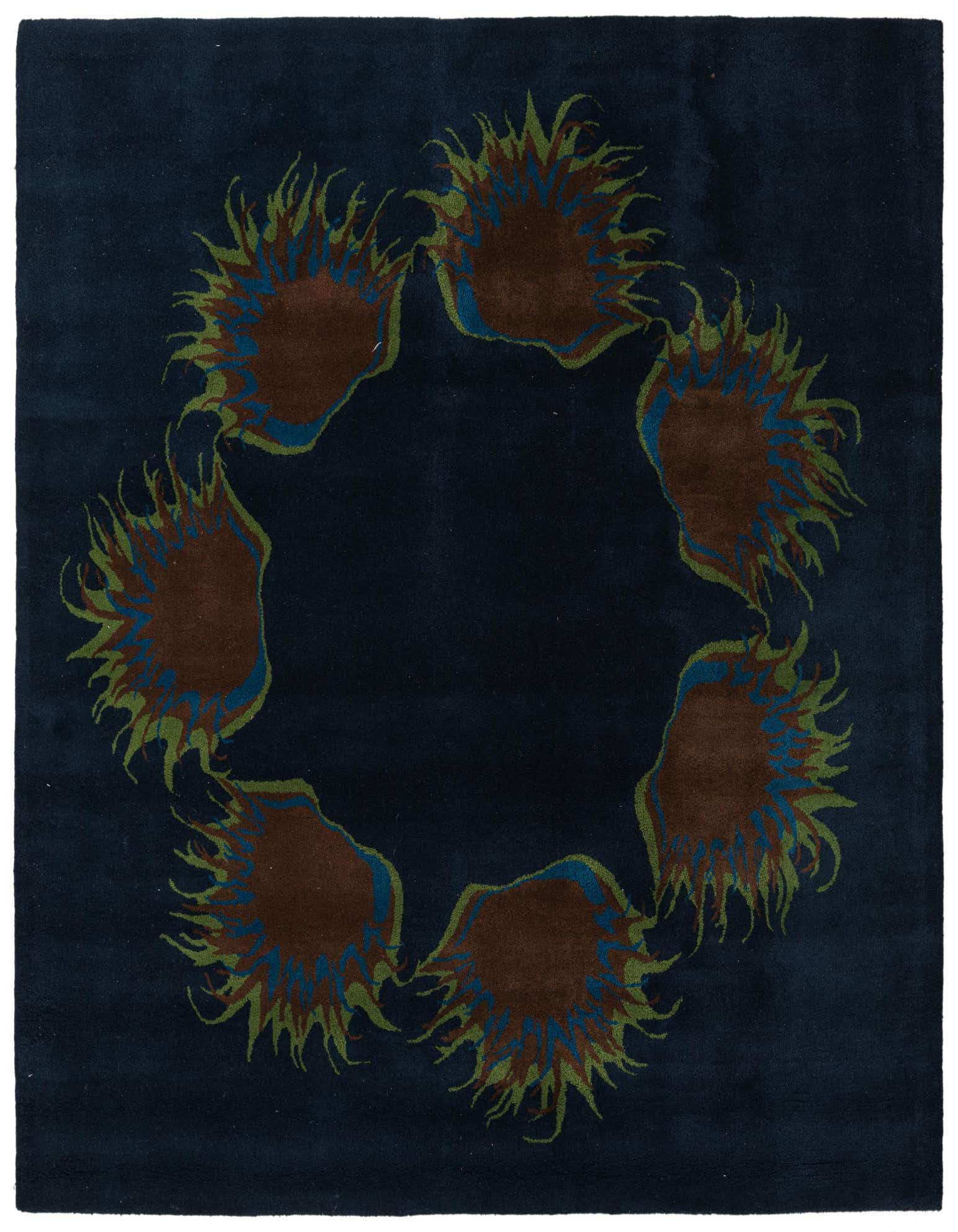 A 7' 7 x 7' 7 square navy blue wool and cotton rug with a circular floral / botanical pattern in brown, green, and blue.