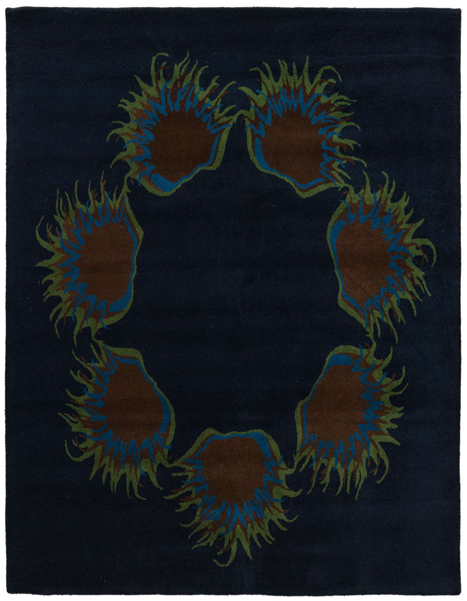 A square navy blue wool and cotton rug with a circular floral pattern featuring brown, blue, and green accents.