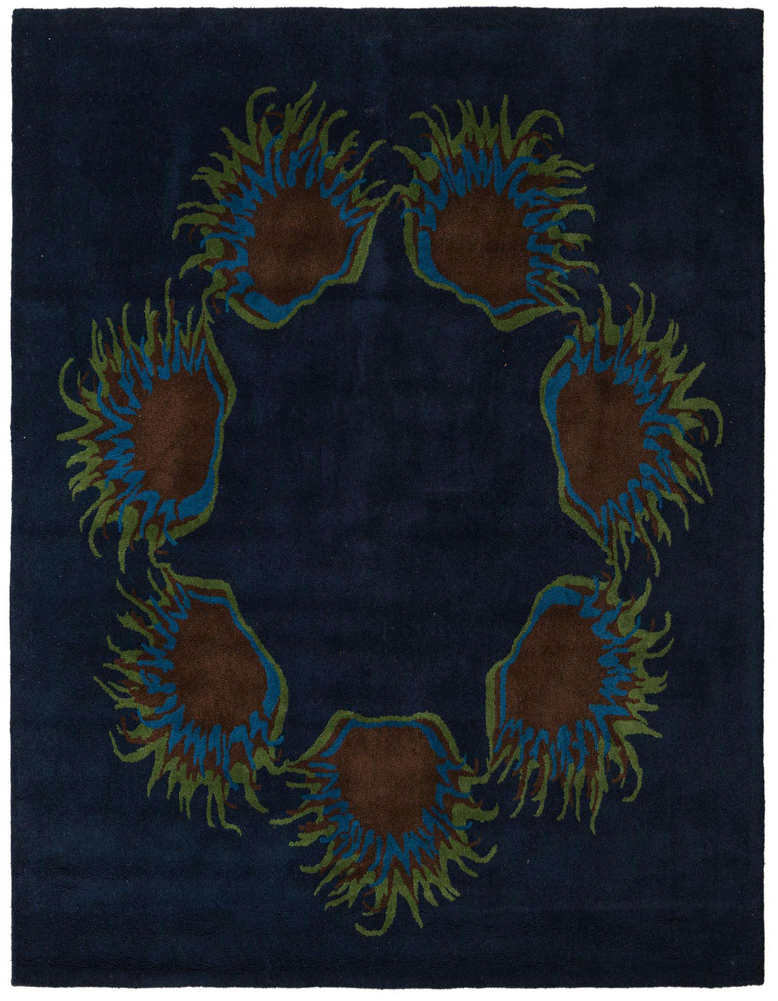 A square navy blue rug with a central circular floral design featuring brown, blue, and green botanical elements.