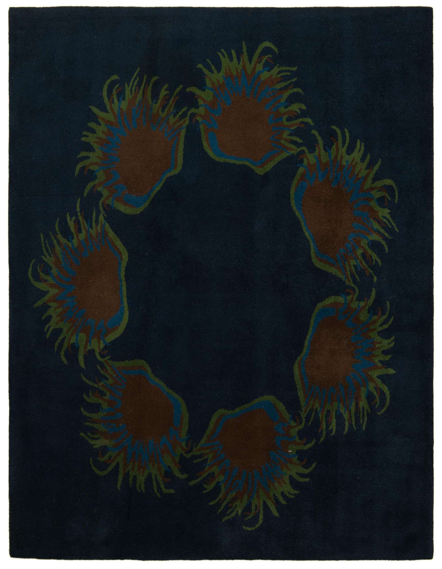 A square Luna collection rug featuring a dark navy blue background with a circular modern floral pattern in brown, green, and blue.