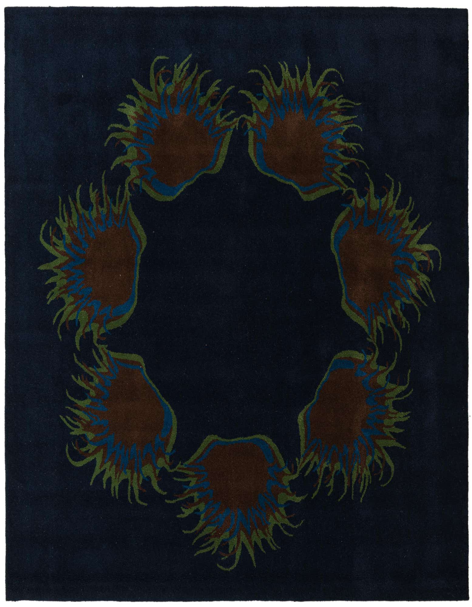 A square navy blue rug with a central circular pattern of six abstract, spiky brown and green floral shapes.