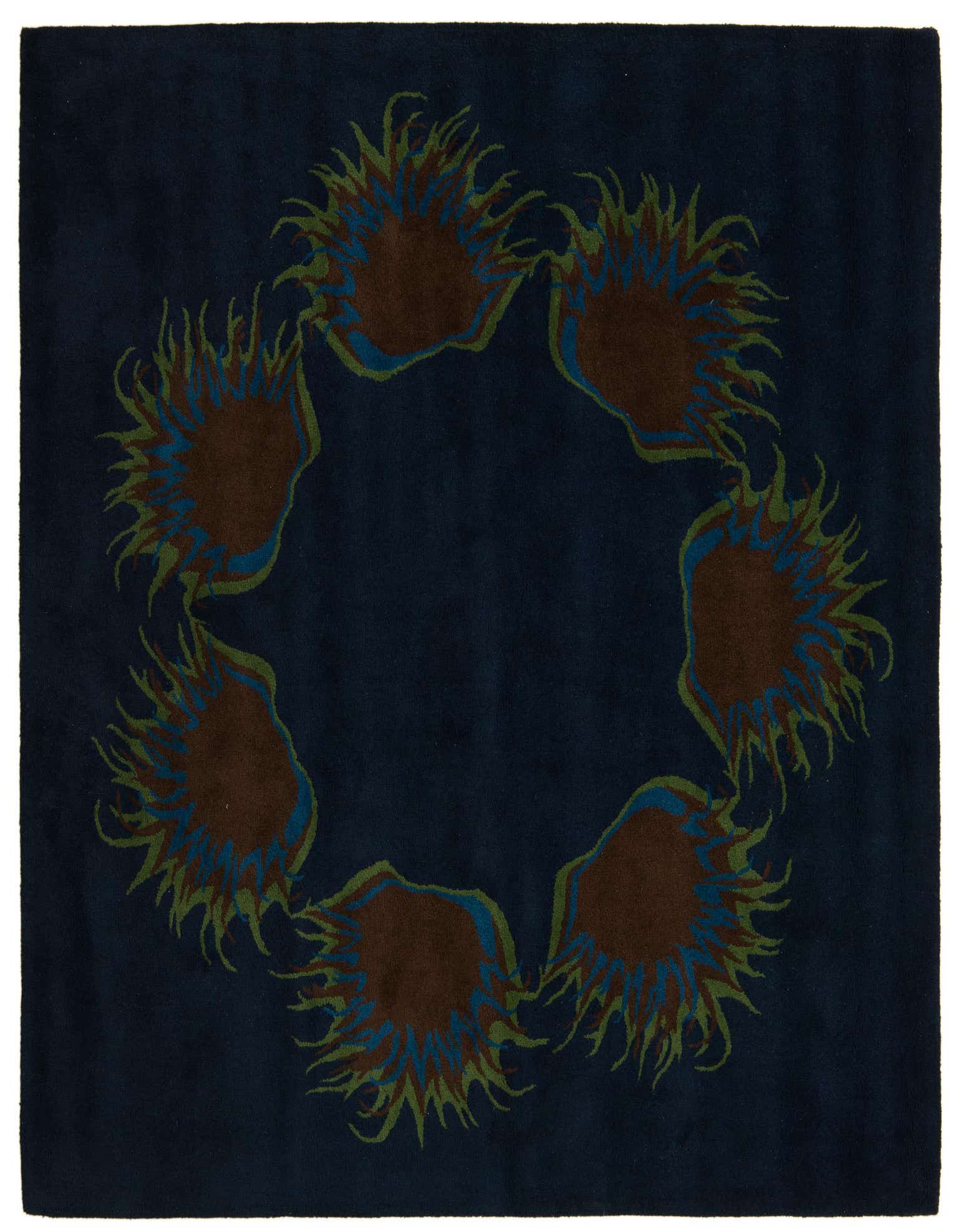 A square navy blue rug with a modern circular pattern of abstract brown, green, and blue shapes.