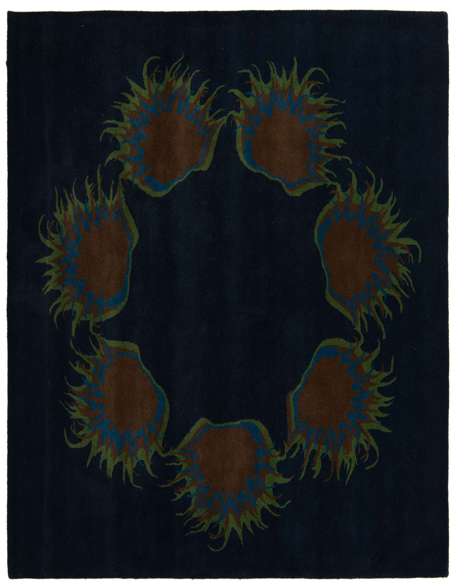 A square navy blue rug with a circular modern floral pattern featuring brown, blue, and green hues.