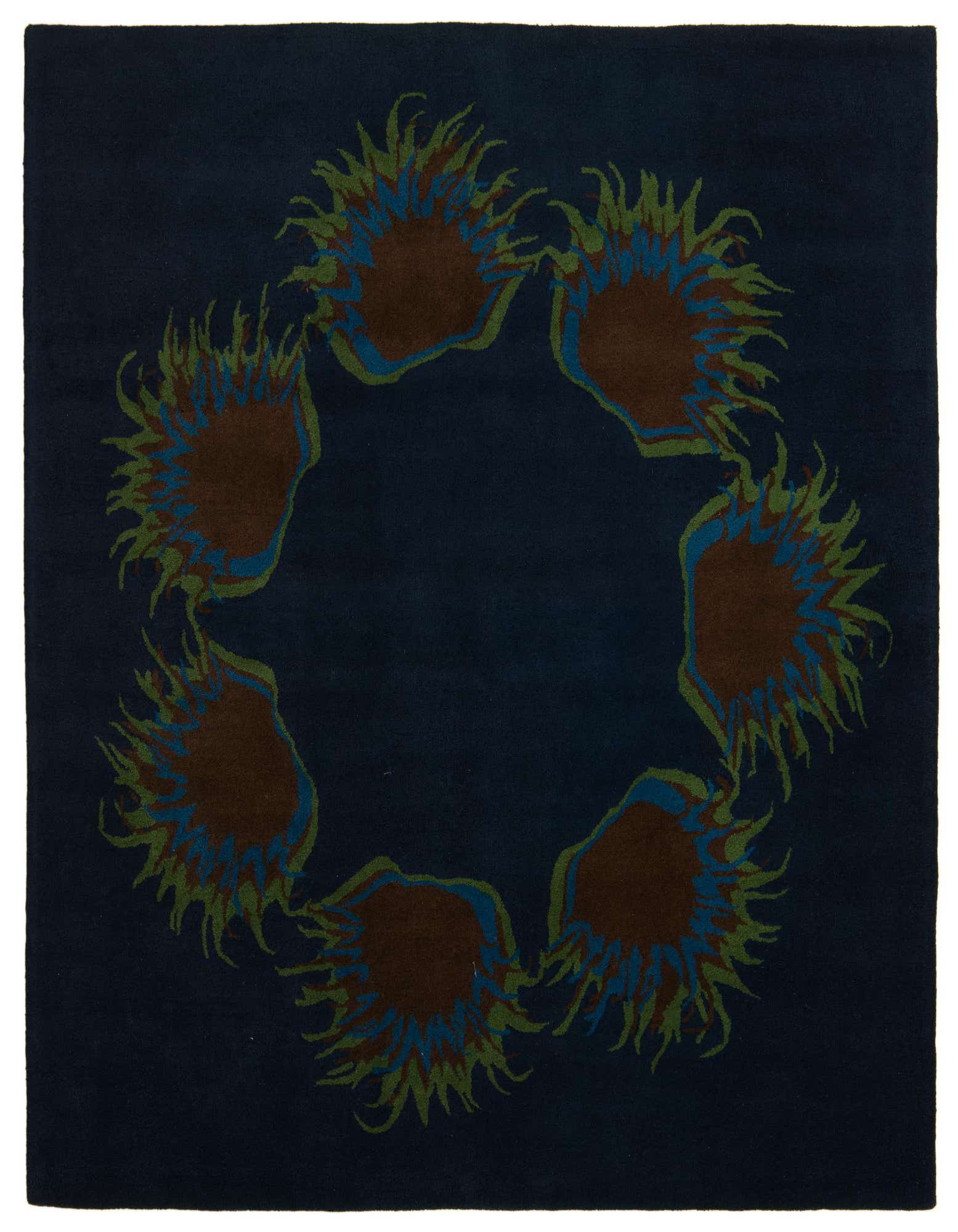 A square navy blue rug with a circular pattern of abstract brown, blue, and green floral shapes.