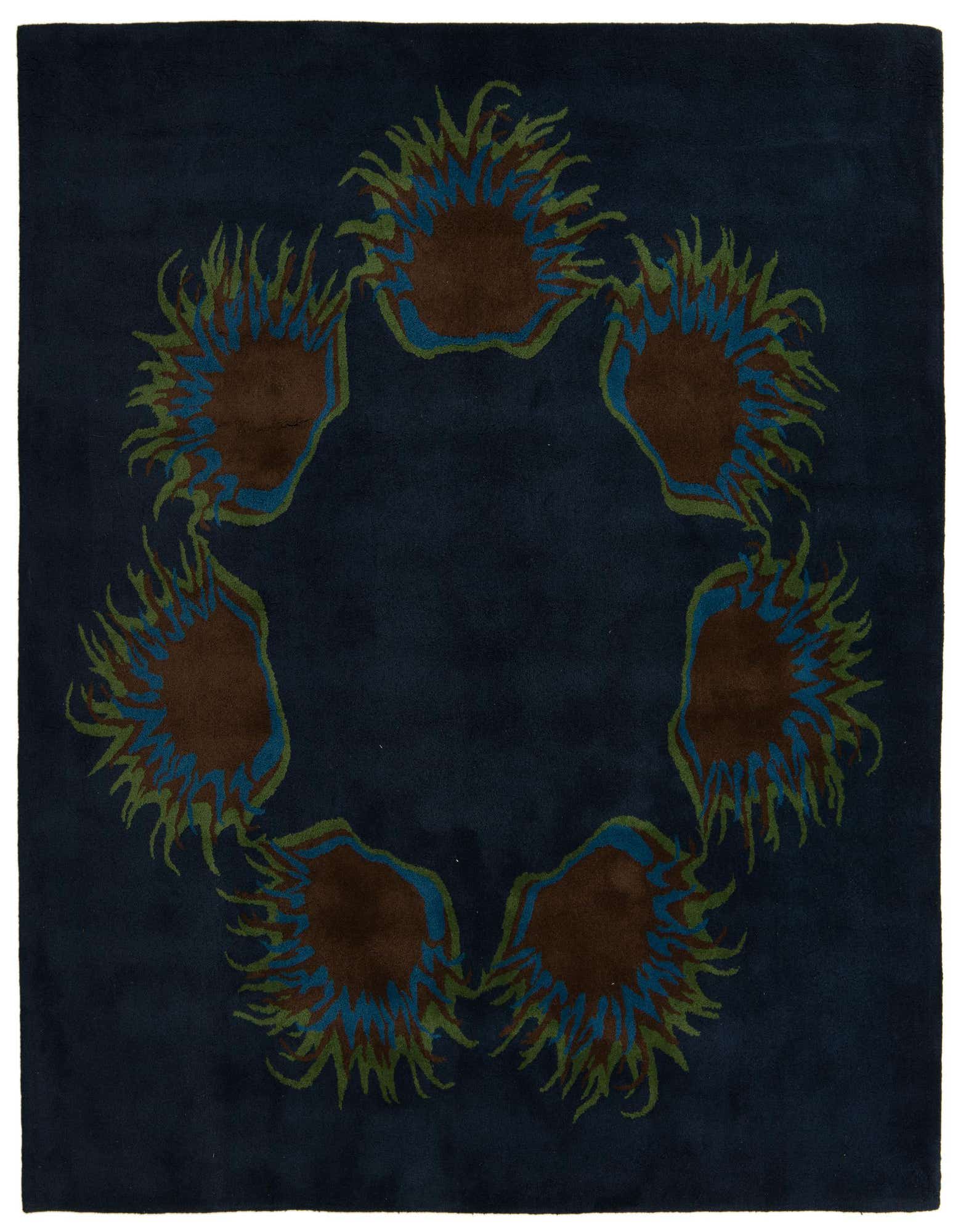 A square navy blue rug with a circular modern floral pattern featuring brown, blue, and green accents.