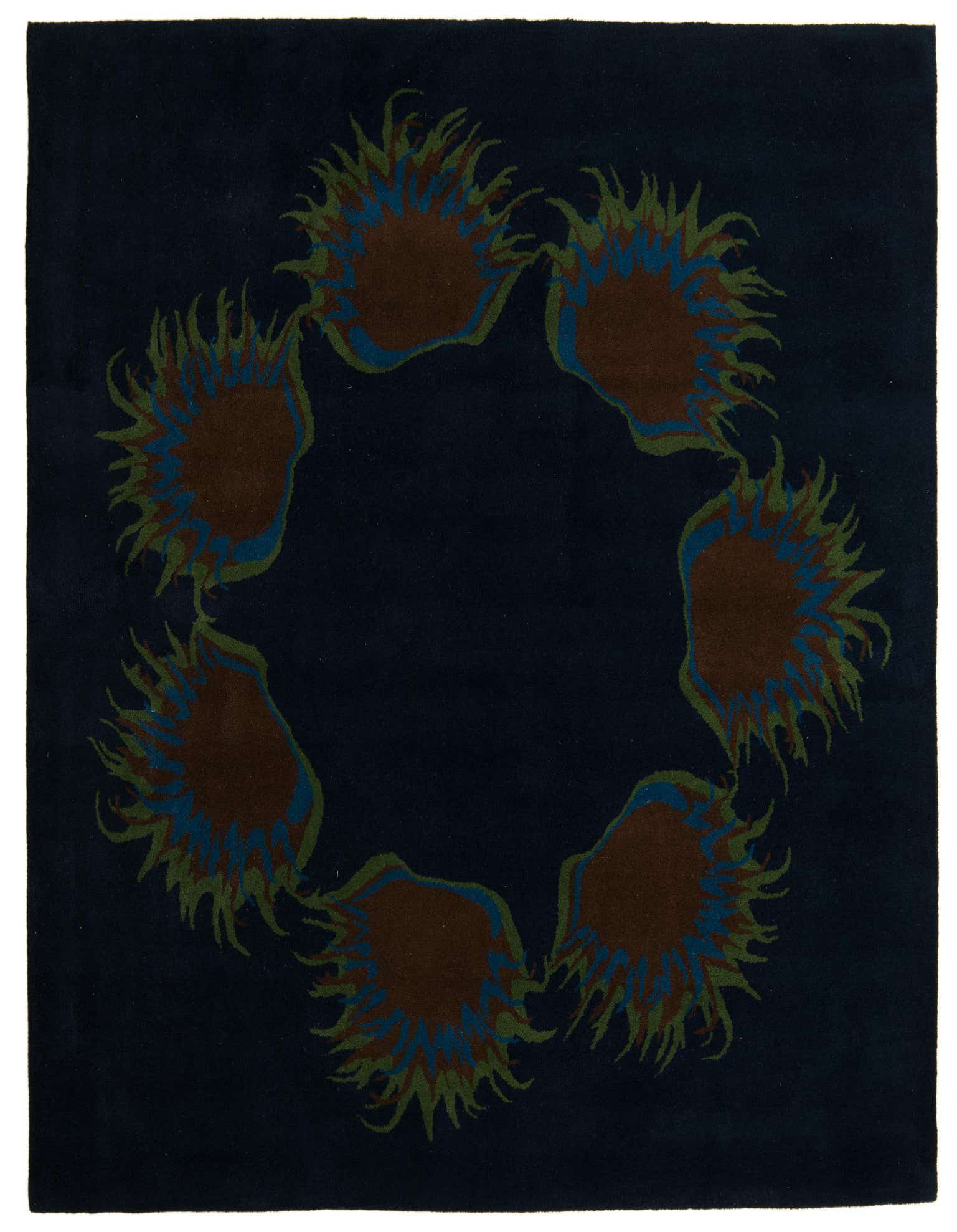 A square navy blue rug with a circular modern pattern of brown, blue, and green spiky shapes.