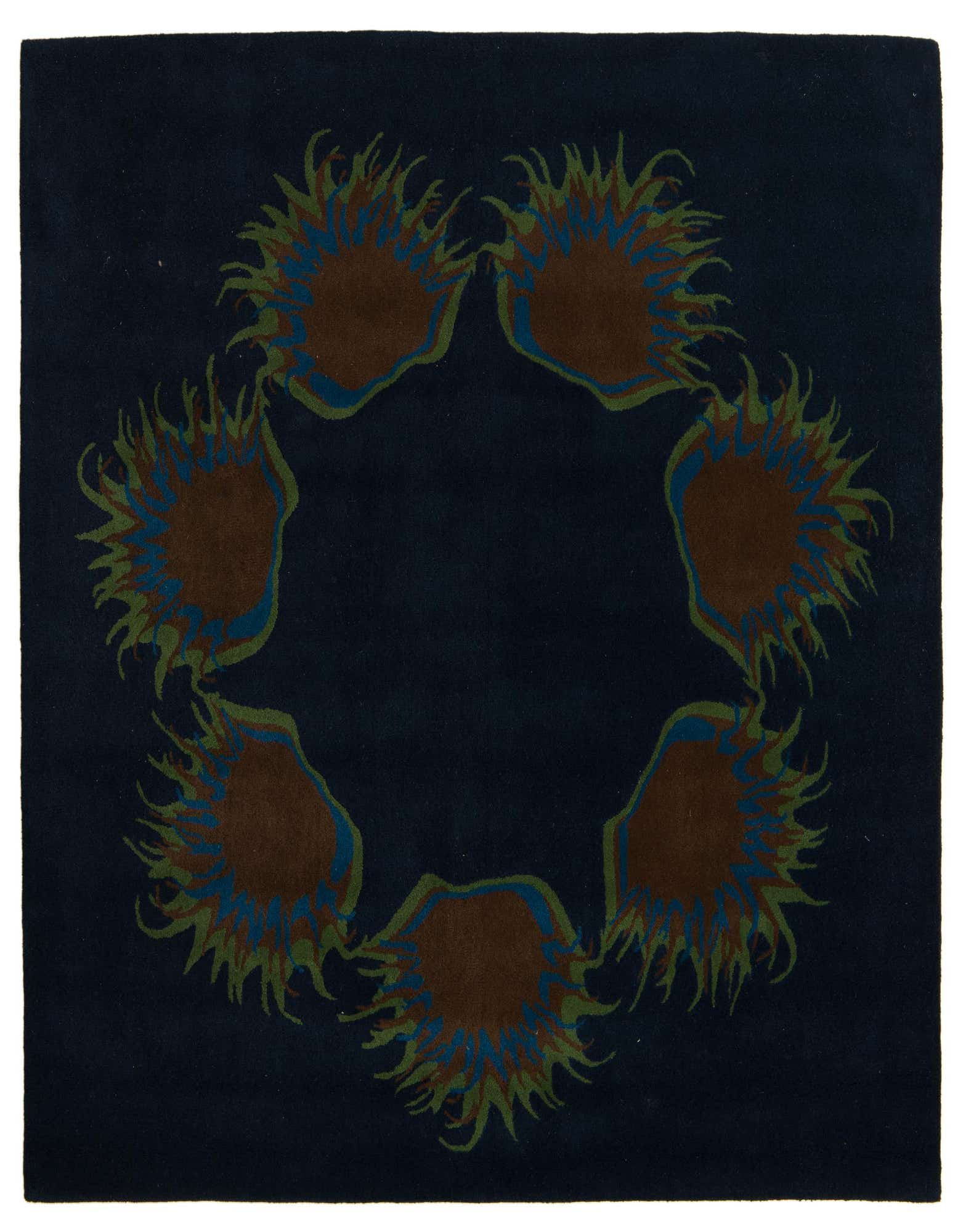 A 7' 5 x 7' 7 square navy blue Luna rug with a circular modern pattern of brown, blue, and green sunburst shapes.
