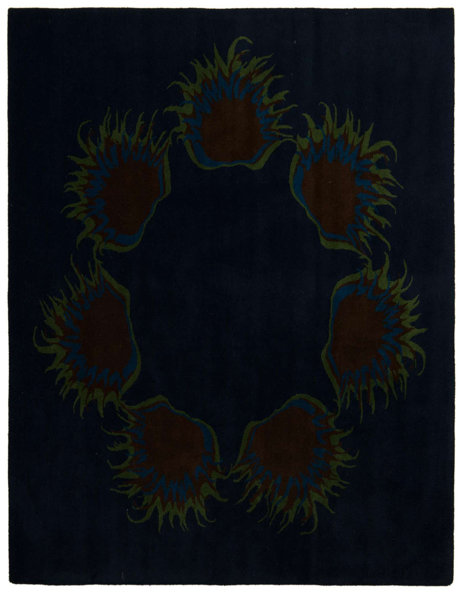 A square navy blue wool and cotton rug with a high pile, featuring a modern circular pattern of abstract brown, blue, and green shapes.