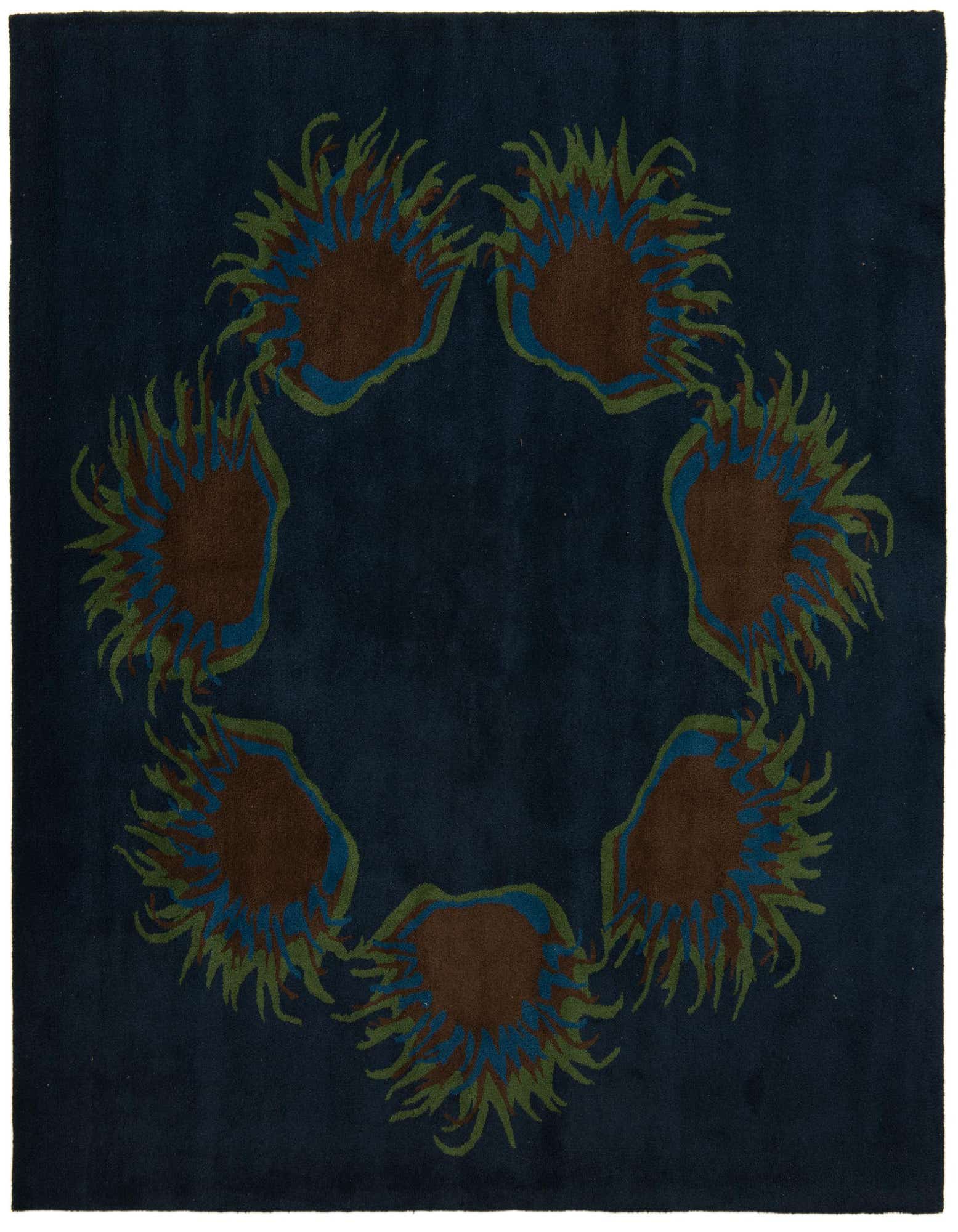 A 7' 7 x 7' 7 square navy blue wool rug with a modern design of six brown, blue, and green abstract floral shapes arranged in a circle.