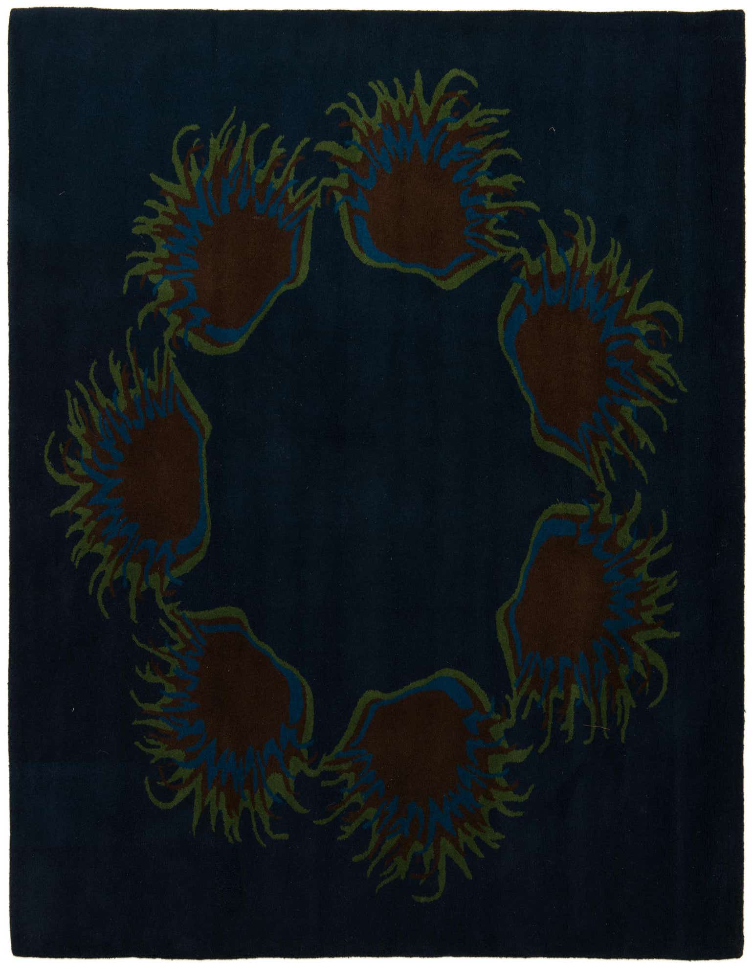 A square navy blue area rug with a modern circular pattern of abstract brown, blue, and green shapes.