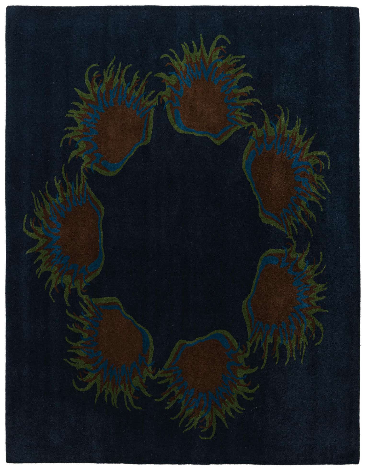 A square navy blue wool rug with a high pile, featuring a circular floral / botanical pattern in brown, green, and blue.