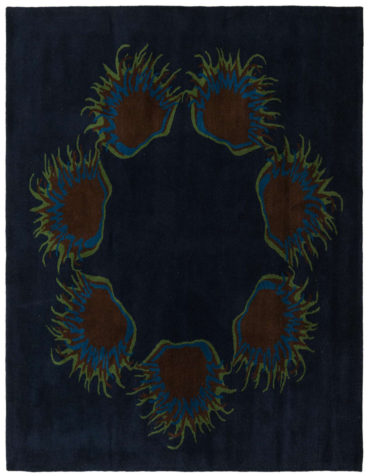A square navy blue wool rug featuring a circular floral pattern with brown, blue, and green botanical elements.