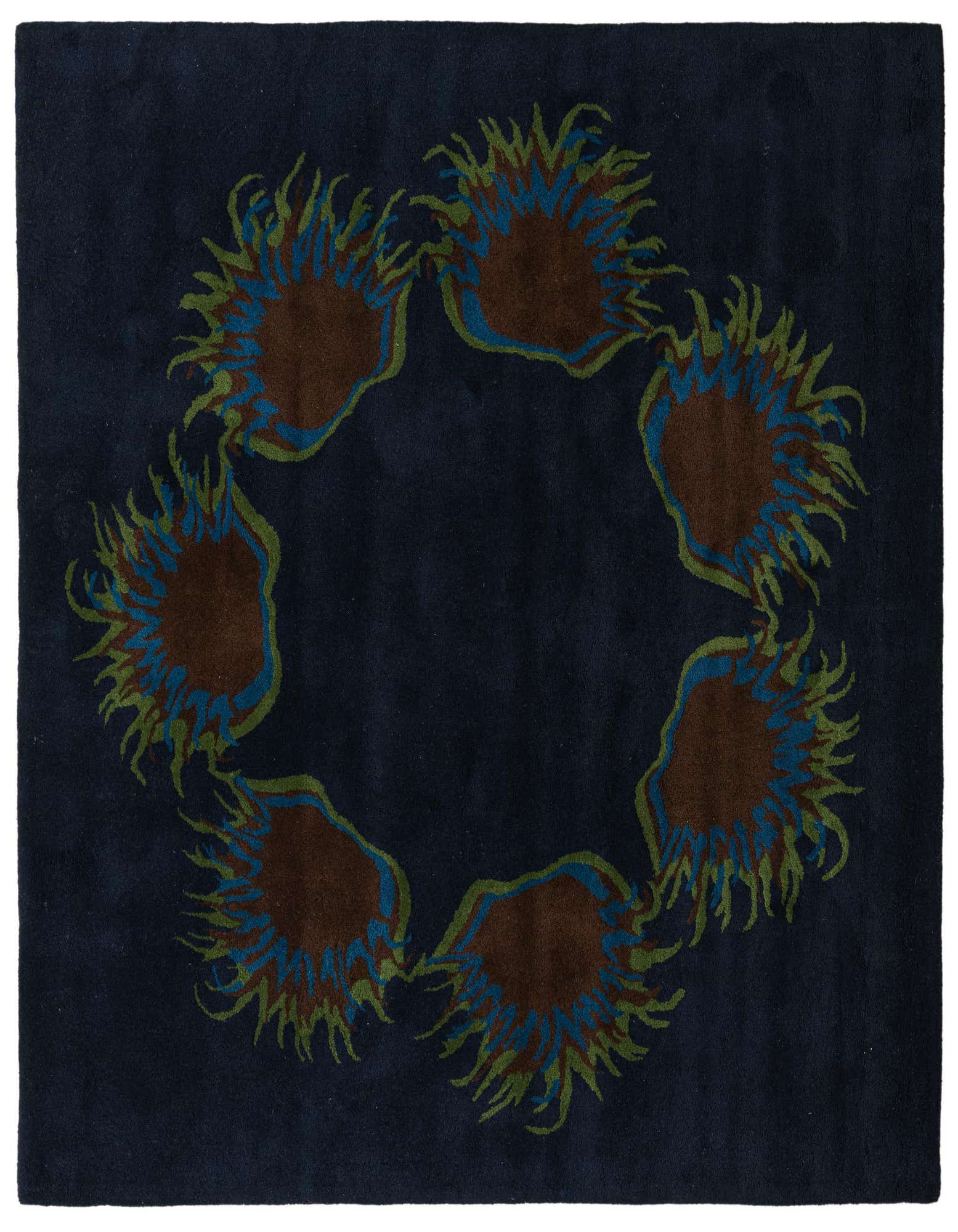A 7' 7 x 7' 7 square navy blue wool rug with a circular floral pattern featuring brown, blue, and green botanical elements.