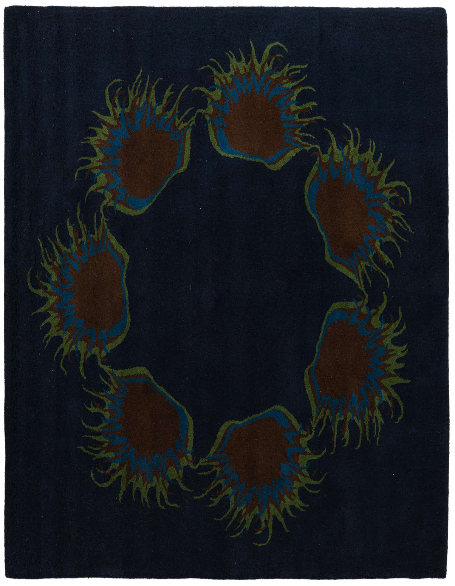 A square navy blue wool rug featuring a circular arrangement of abstract brown, blue, and green floral shapes.