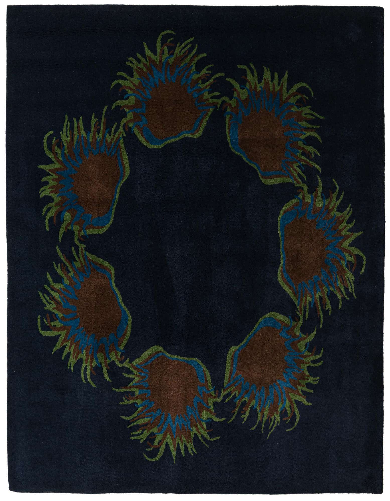 A 7' 5 x 7' 7 square navy blue wool rug featuring a circular arrangement of six brown, blue, and green floral or botanical motifs.