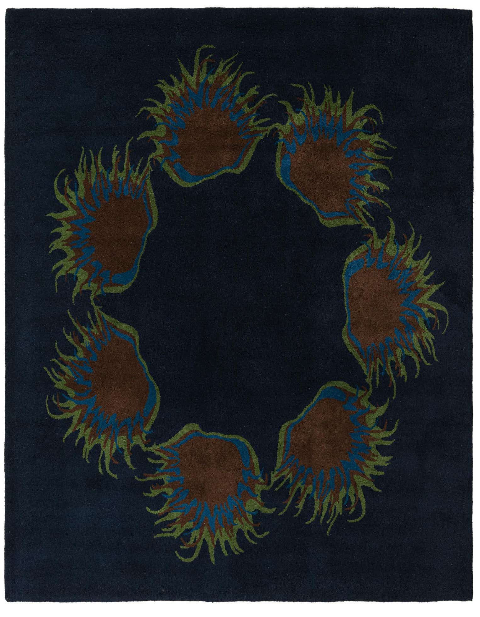 A square navy blue wool rug with a high pile, featuring a circular floral pattern with brown, blue, and green botanical elements.