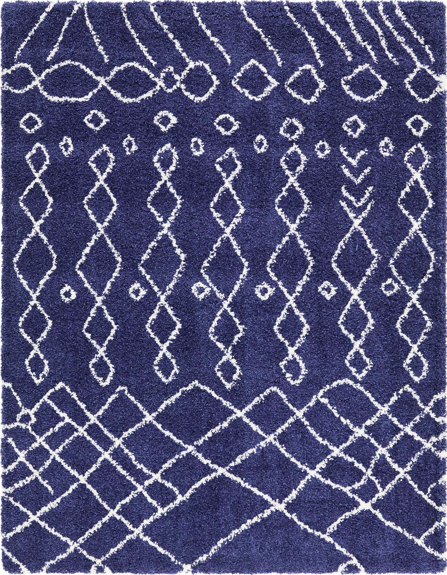 A square navy blue shag rug with a white tribal trellis pattern, featuring diamonds and lines, perfect for a modern living room.