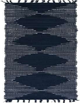 A long, narrow navy blue cotton runner rug with a flatweave texture and fringed ends, featuring a subtle tribal-inspired pattern of white horizontal lines forming diamond shapes.