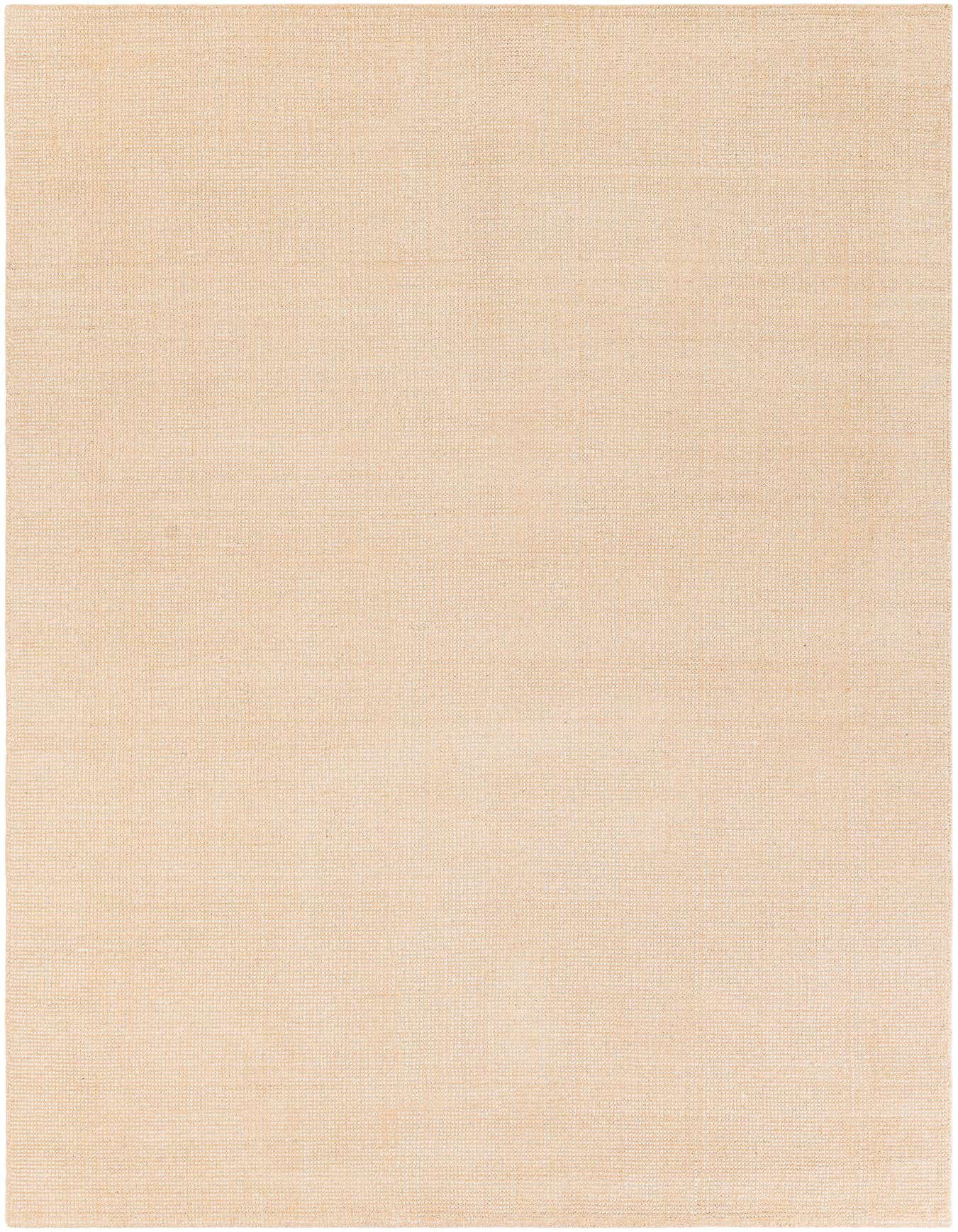 A 6x9 rectangular Jill Zarin English Manor rug in a solid oat beige color, featuring a subtle textured pile.