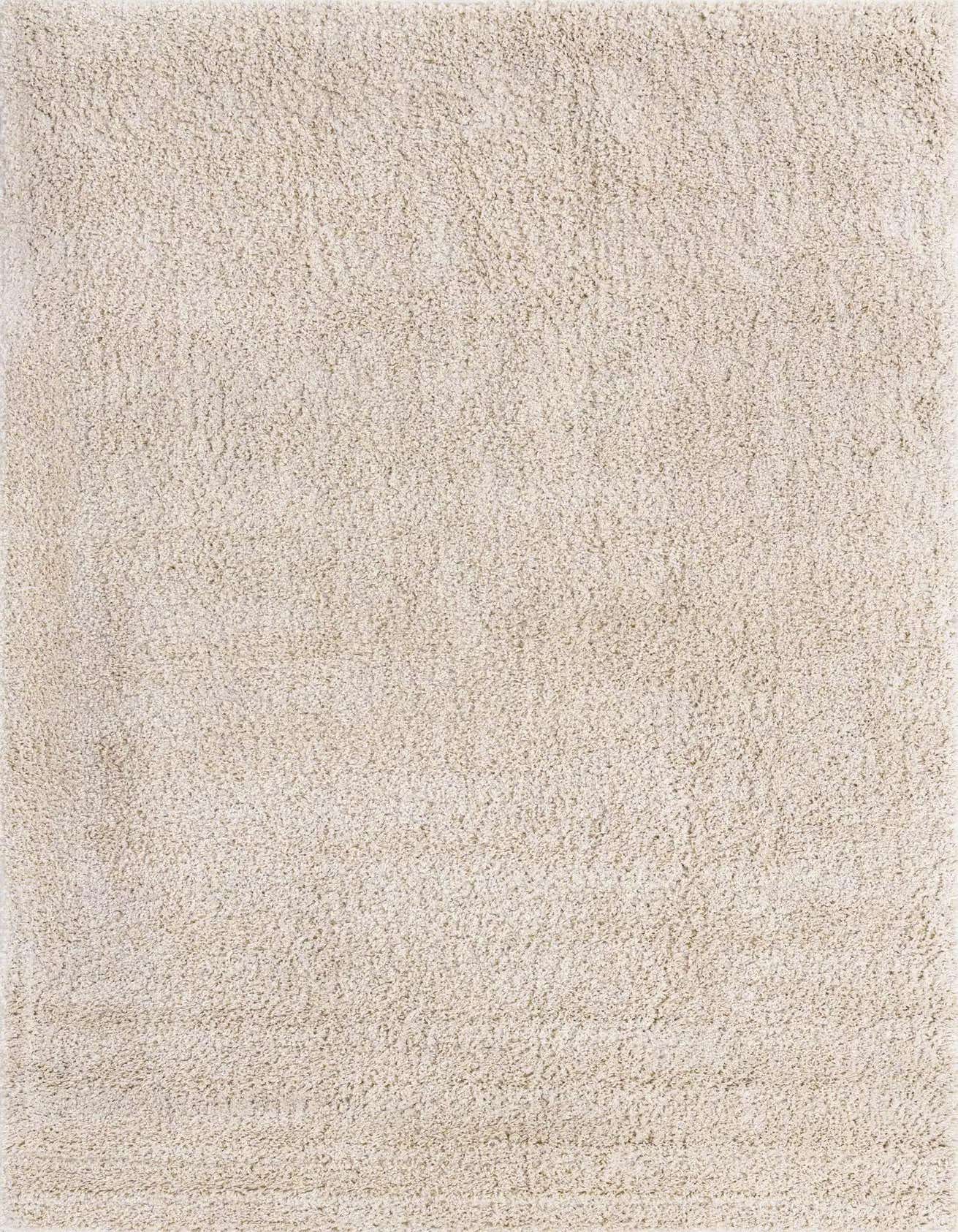 A 5x8 rectangular ivory shag rug with a plush, textured pile, perfect for a modern living room or bedroom.