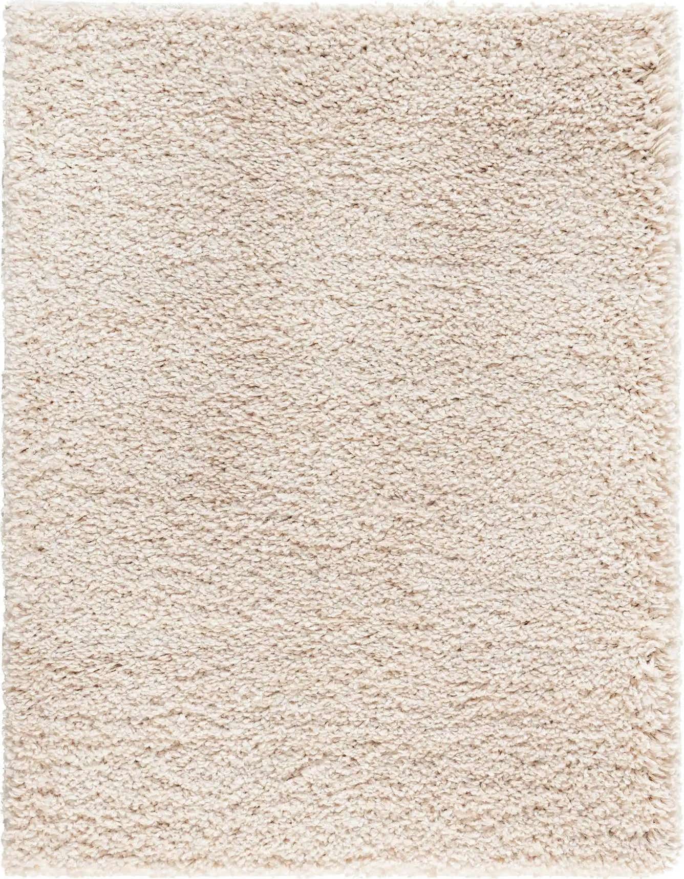 A close-up view of a rectangular 4x6 ivory shag rug, showcasing its plush, textured pile.