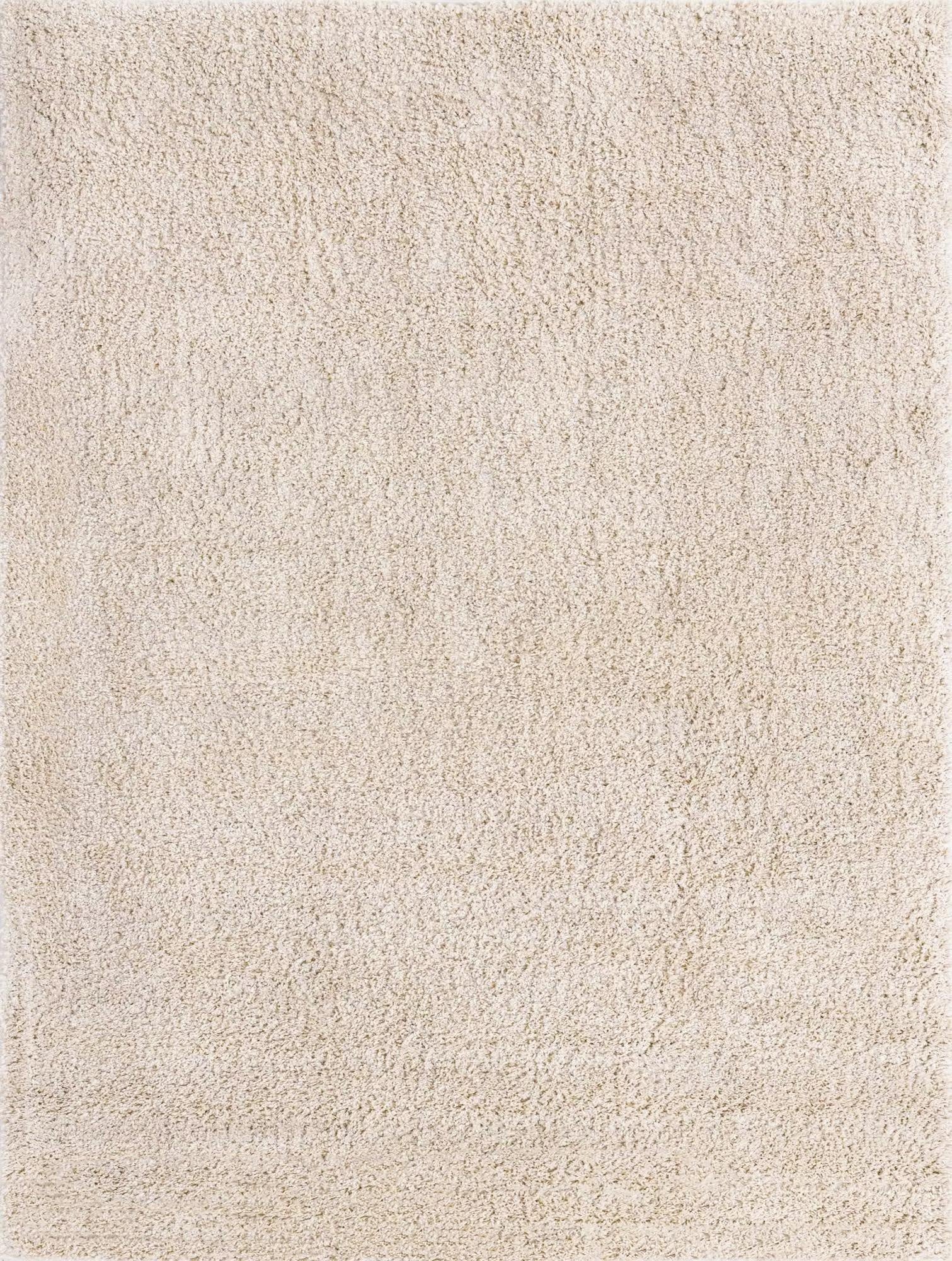 A rectangular 10x13 ivory shag rug with a plush, textured pile, suitable for a living room or bedroom.