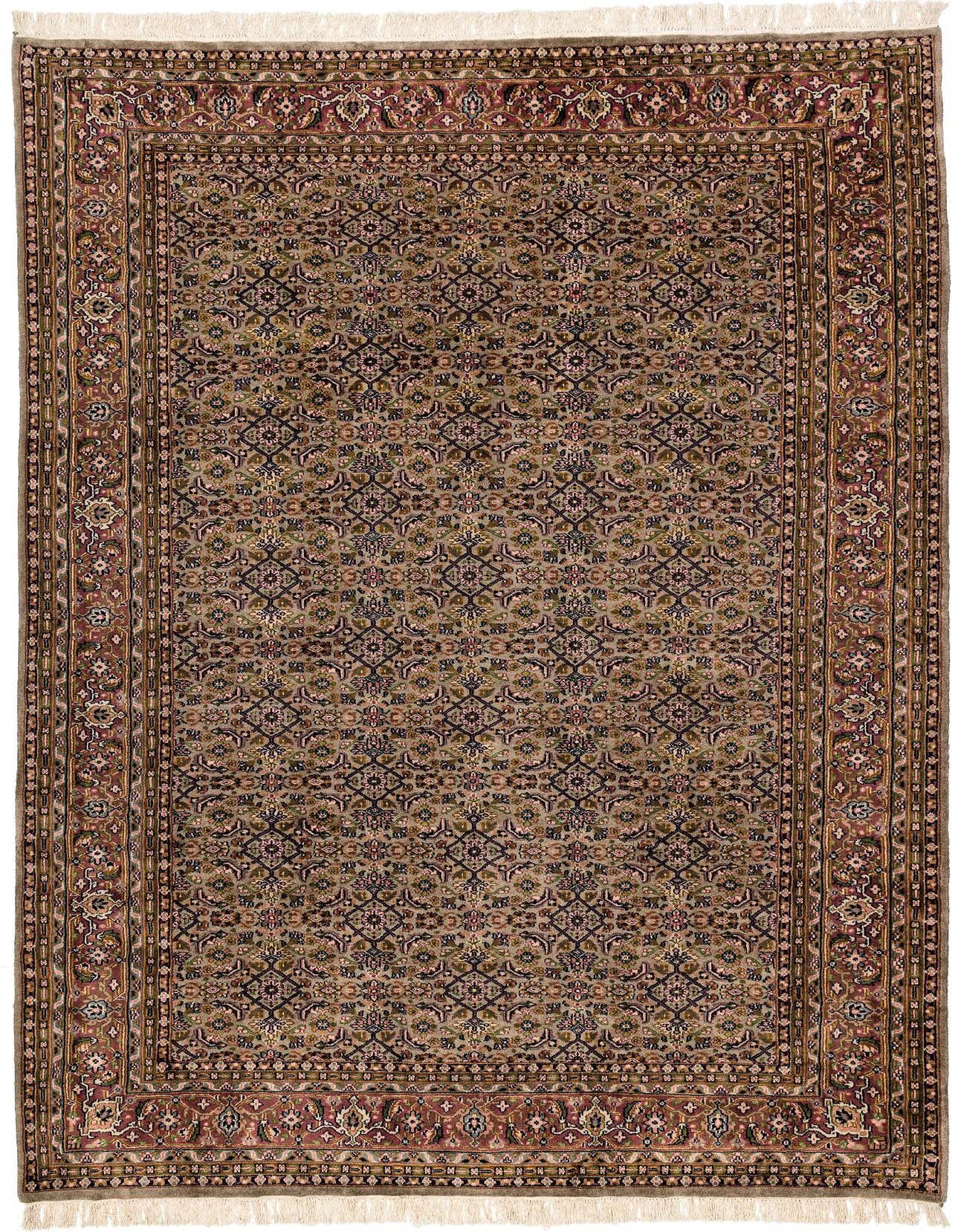 A 7x10 rectangular Farahan rug featuring an intricate green, brown, and pink floral oriental pattern with a detailed border and fringe.