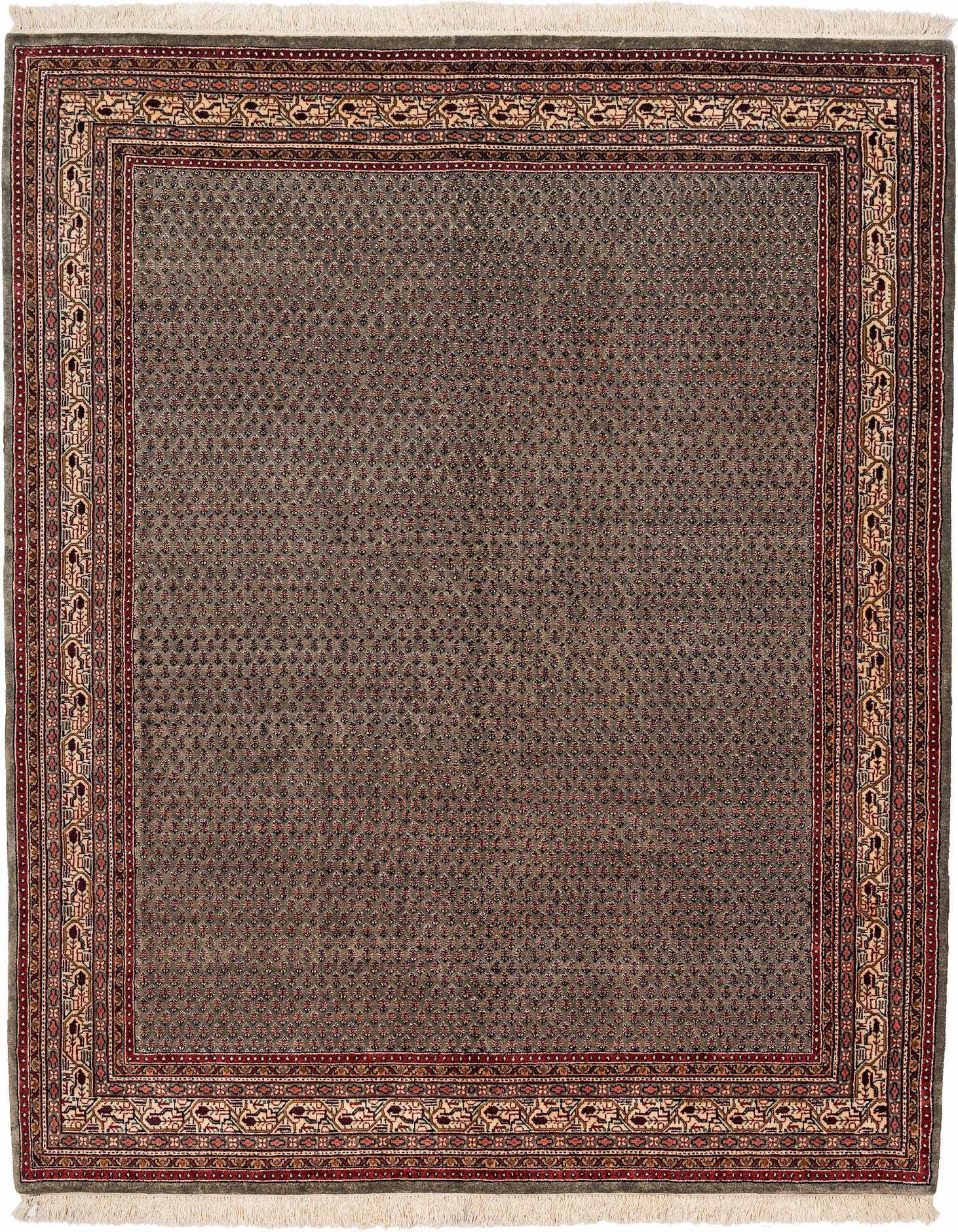 A 5x8 rectangular green wool rug with a detailed oriental border in red and cream, featuring a subtle modern pattern.