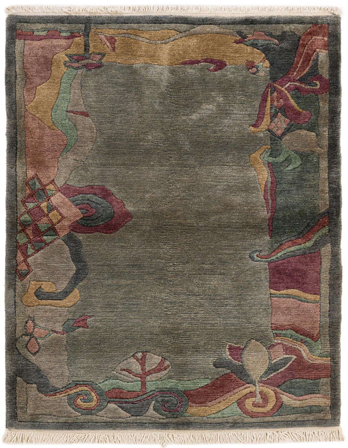 A 3x5 rectangular Nepal rug from Rugs.com, featuring a green field with a colorful abstract border in shades of green, gold, and maroon, with white fringe.