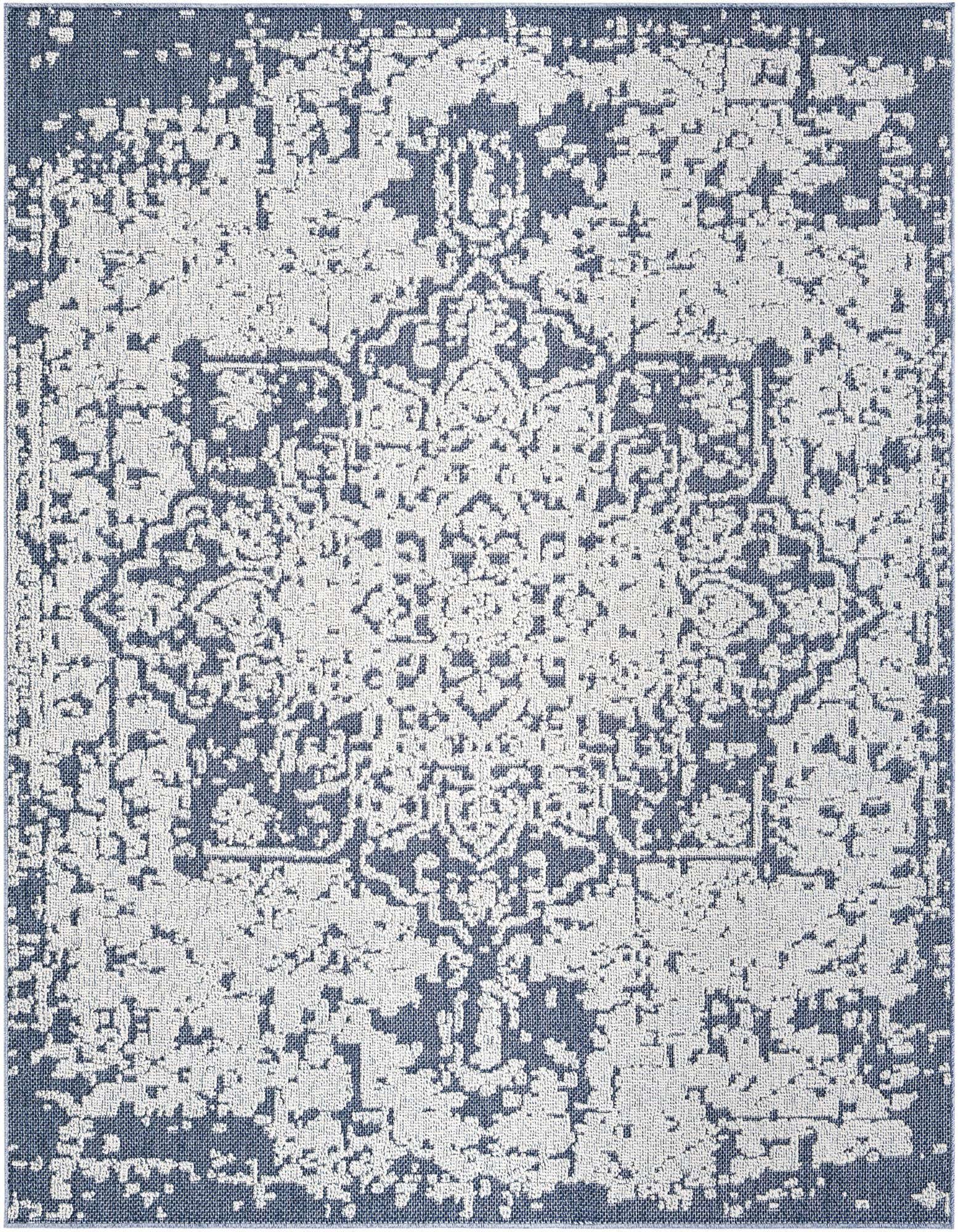 A square 7' 10 x 7' 10 indoor/outdoor rug with a distressed traditional medallion pattern in shades of green.