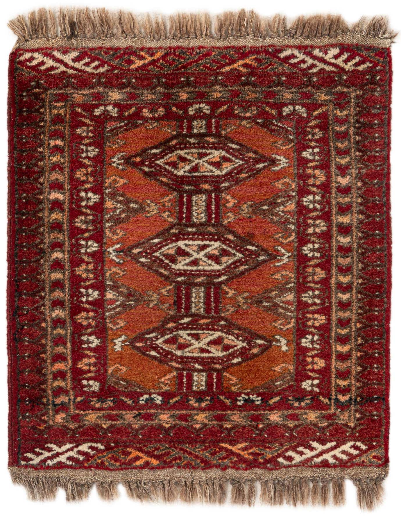 A 1x2 rectangular Afghan Ersari tribal rug in rich oranges and reds with intricate geometric patterns and fringed ends.