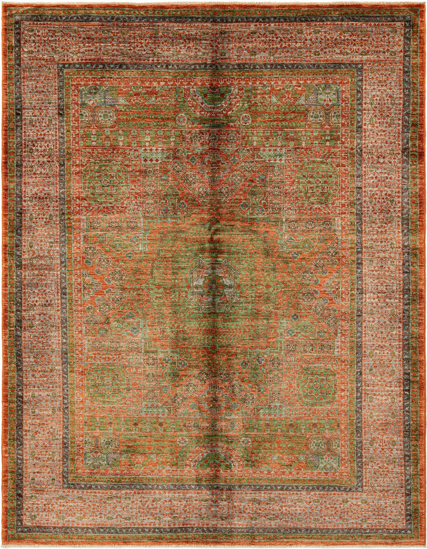 A rectangular handmade Persian wool rug featuring a distressed orange and green floral pattern with a detailed border.