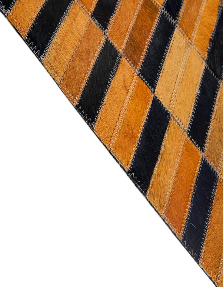 Detail image of  5' 1 x 7' 11 Cowhide - Patchwork Rug