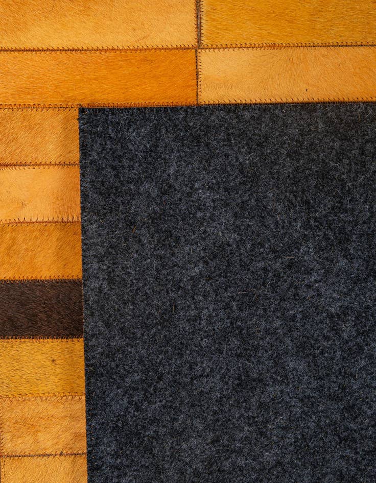 Detail image of  5' 1 x 7' 11 Cowhide - Patchwork Rug