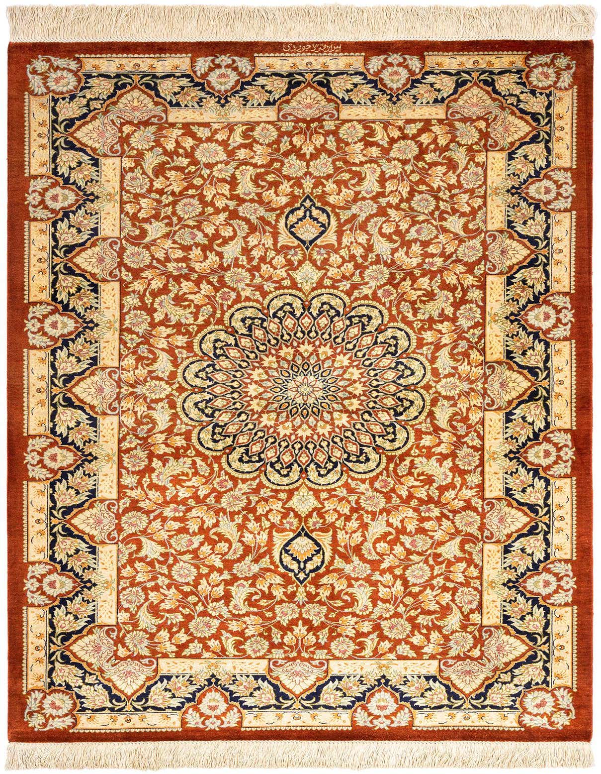 A 3x5 rectangular Ghom Silk Persian rug featuring a central medallion and intricate floral patterns in shades of orange, cream, and navy.