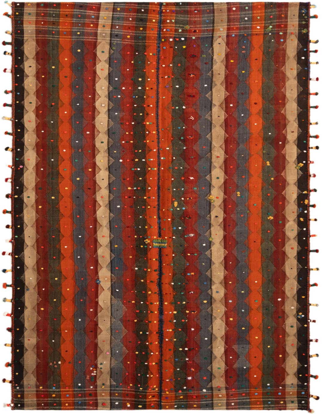 A rectangular 5x8 Jajim rug with vertical stripes in shades of orange, red, blue, and tan, featuring colorful polka dots and small tassels along the sides.