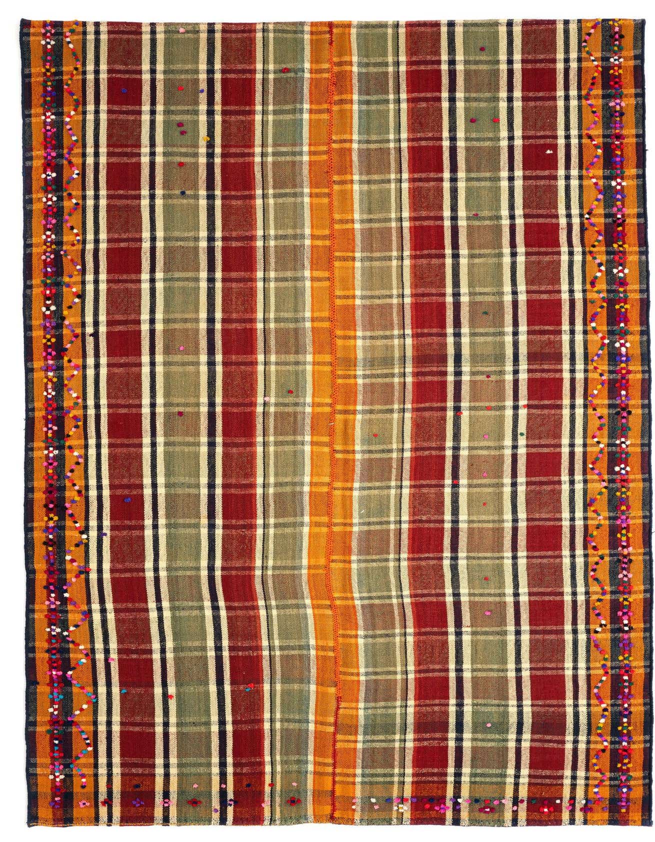 A 5x8 rectangular Jajim rug featuring a vibrant plaid pattern in oranges, reds, greens, and creams, with decorative multicolored pom-pom borders.