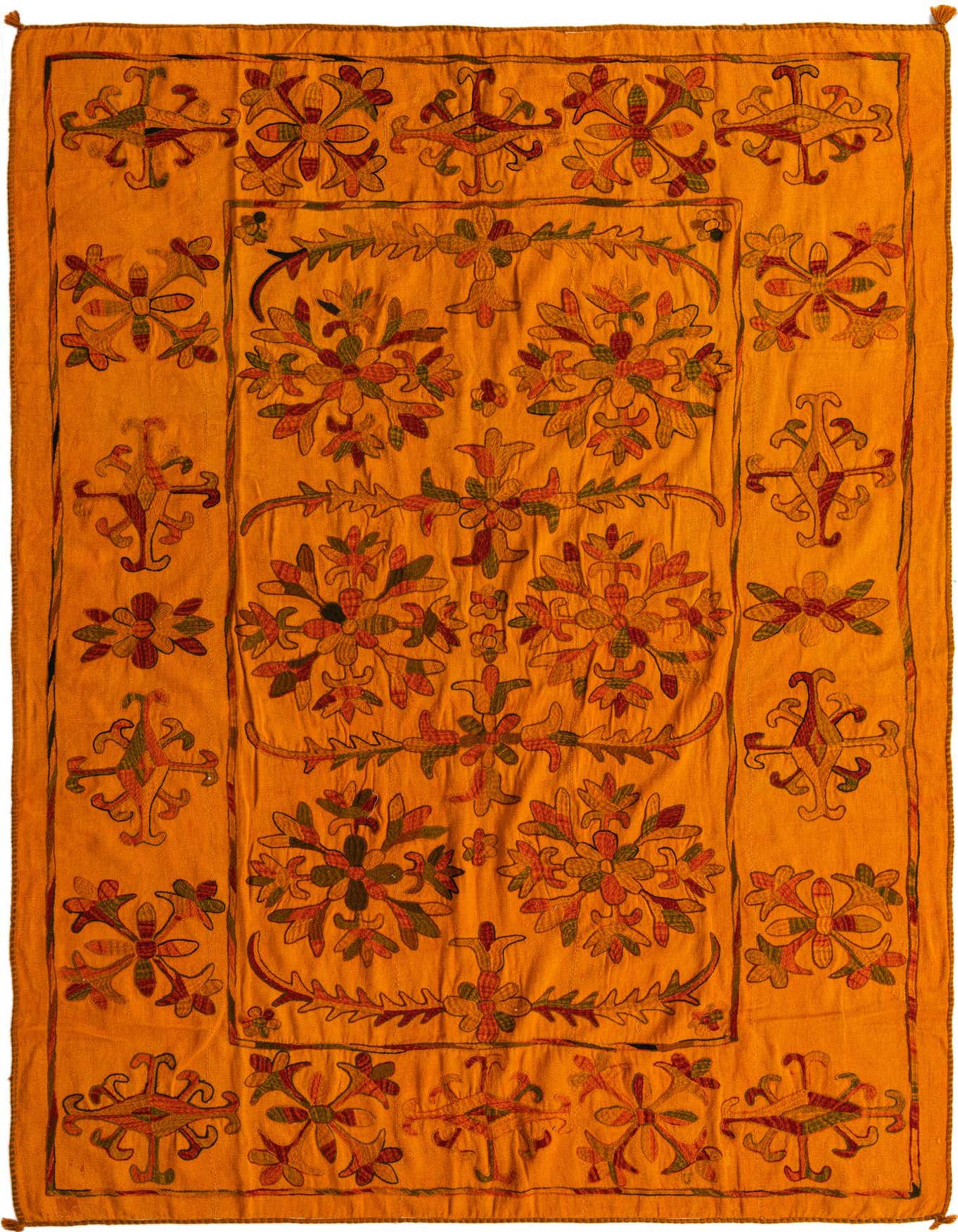 A 7x10 rectangular orange flatweave rug with a detailed tribal floral pattern in red, green, and gold.