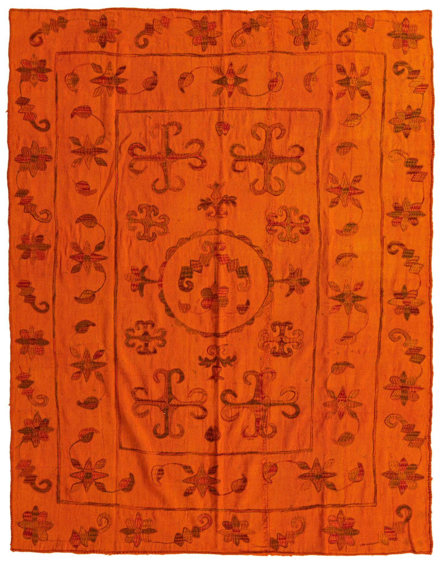 A 5x8 rectangular orange Kilim Suzani rug with a tribal, oriental pattern of flowers and geometric shapes.