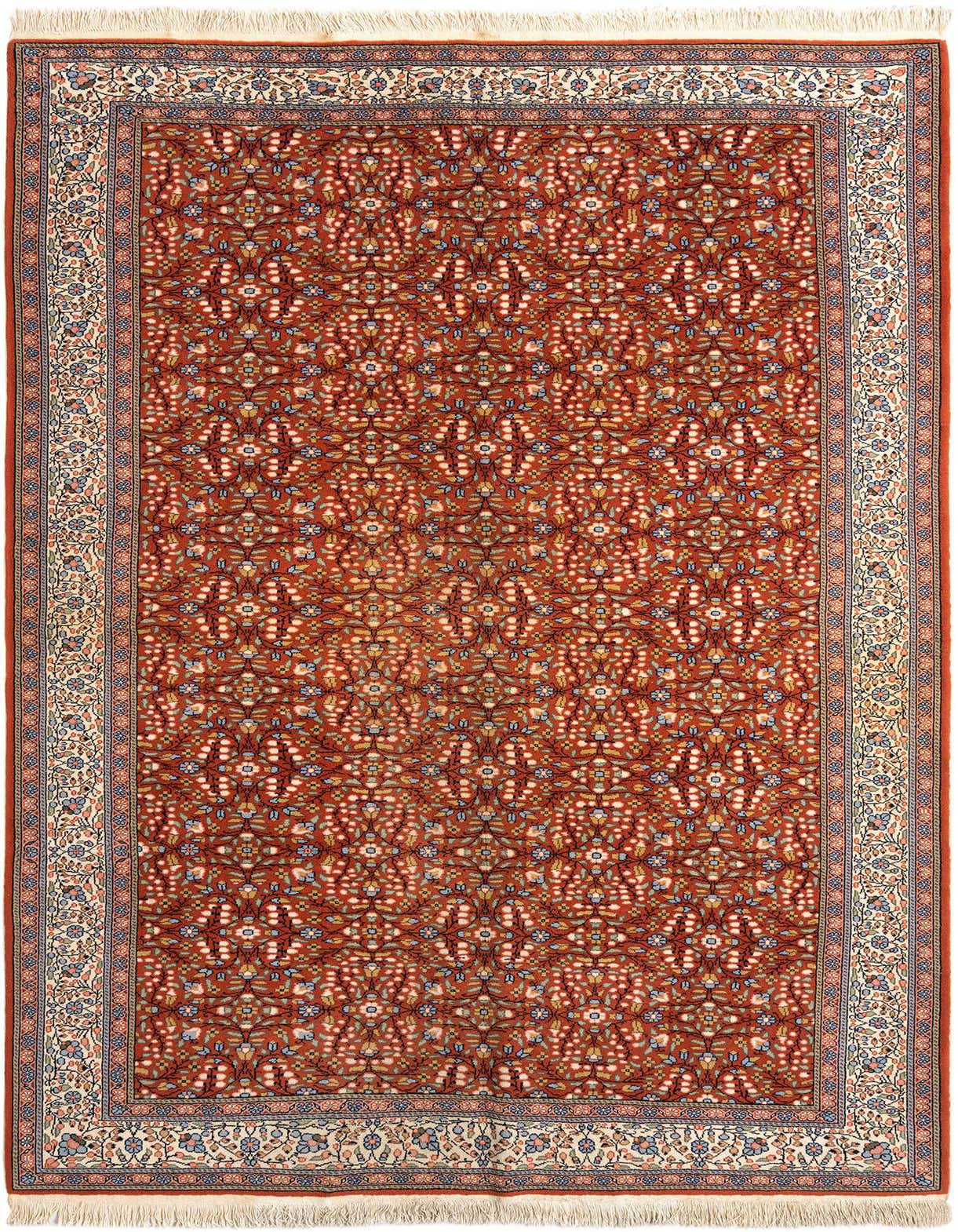 A 7x10 rectangular Rugs.com Mazedonier Persian rug in rich orange with intricate floral patterns and a cream border.