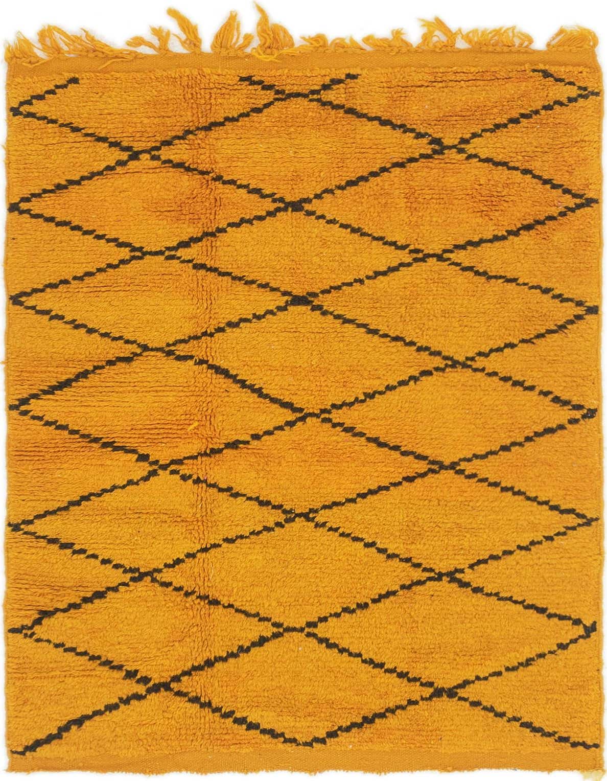 A 4x6 rectangular orange shag rug with a black tribal diamond pattern and fringed edges, ideal for a living room.