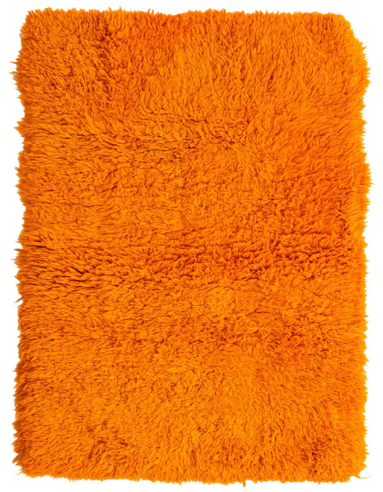 A vibrant 4x6 rectangular orange shag rug, handmade from wool, offering a plush texture for a living room or bedroom.
