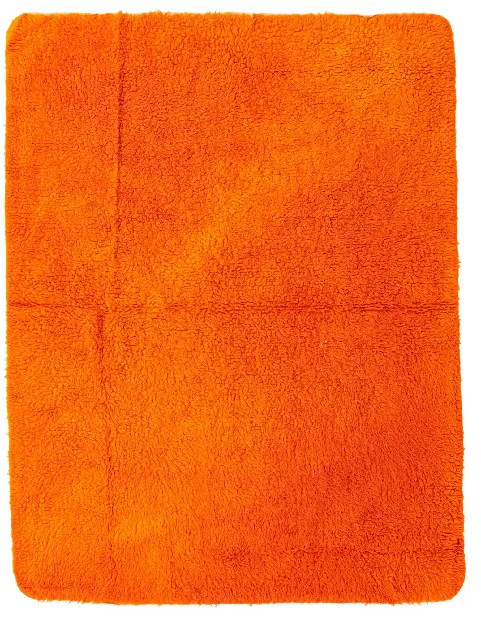 A vibrant 4x6 rectangular orange shag rug with a plush, textured pile, perfect for a modern living room.