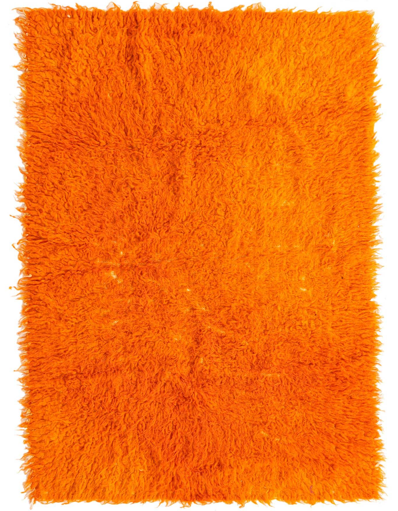 A vibrant 3x5 rectangular orange shag rug, handmade from wool, featuring a plush, textured pile.