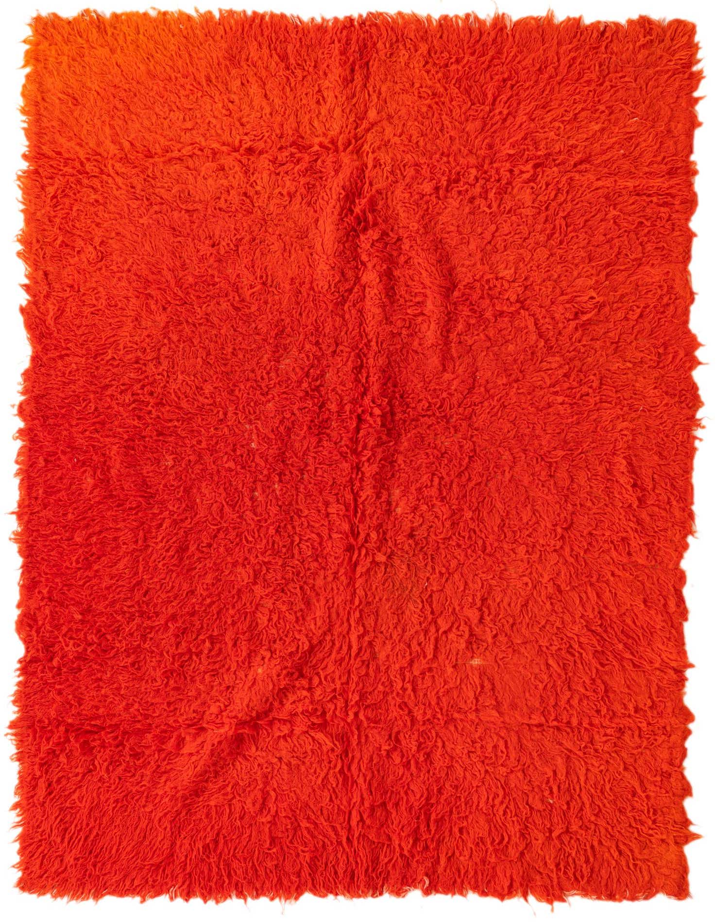 A vibrant 4x6 rectangular orange shag rug, handmade from wool, featuring a plush, textured pile.