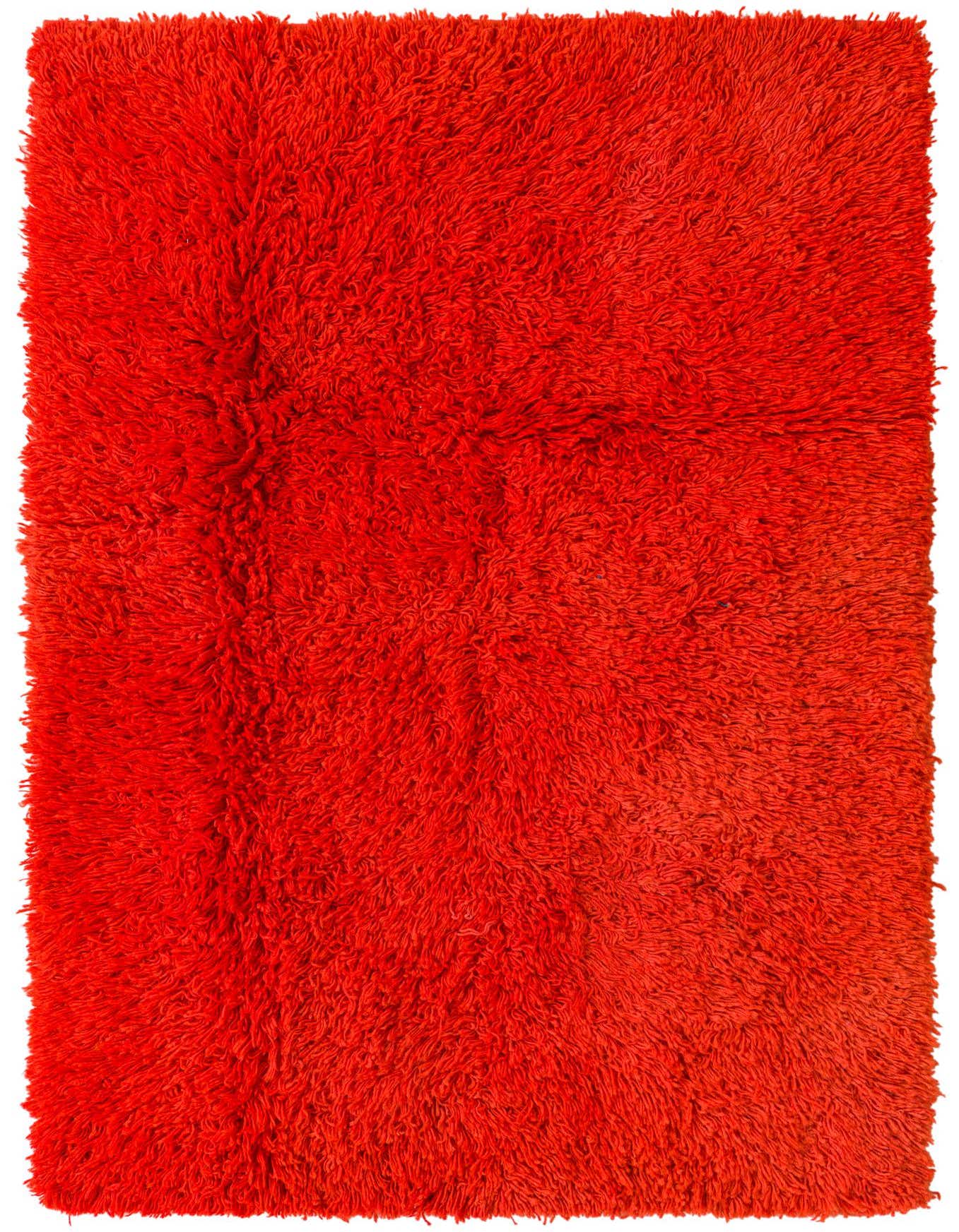 A vibrant 4x6 rectangular orange shag wool rug with a thick, plush pile, suitable for a living room.