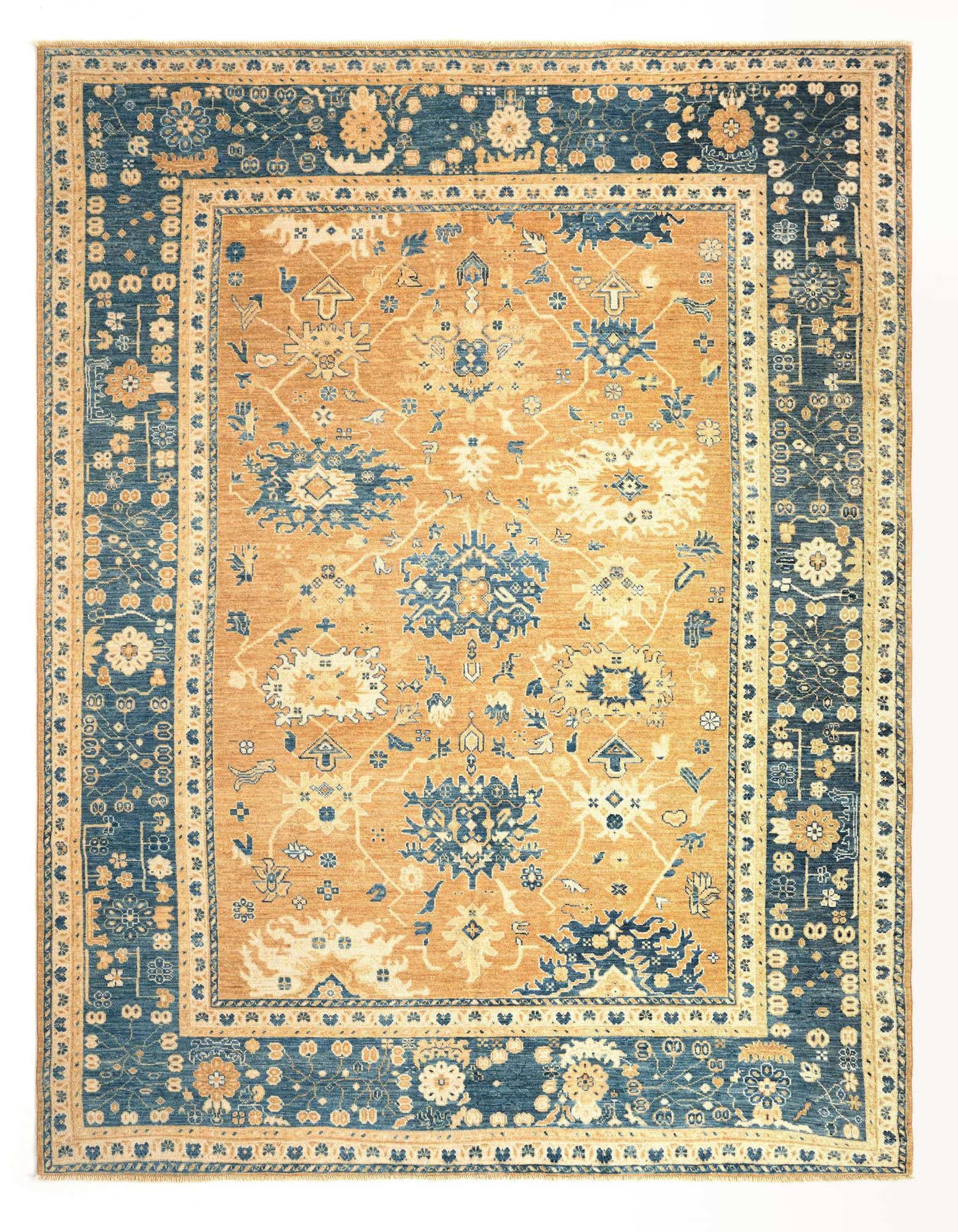 A 9x12 rectangular Oushak rug with an orange field and intricate blue and cream floral Oriental patterns, featuring a wide blue border.